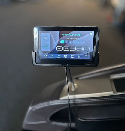 A dashboard view of a car displaying a tablet mounted for easy access to navigation and multimedia functions.