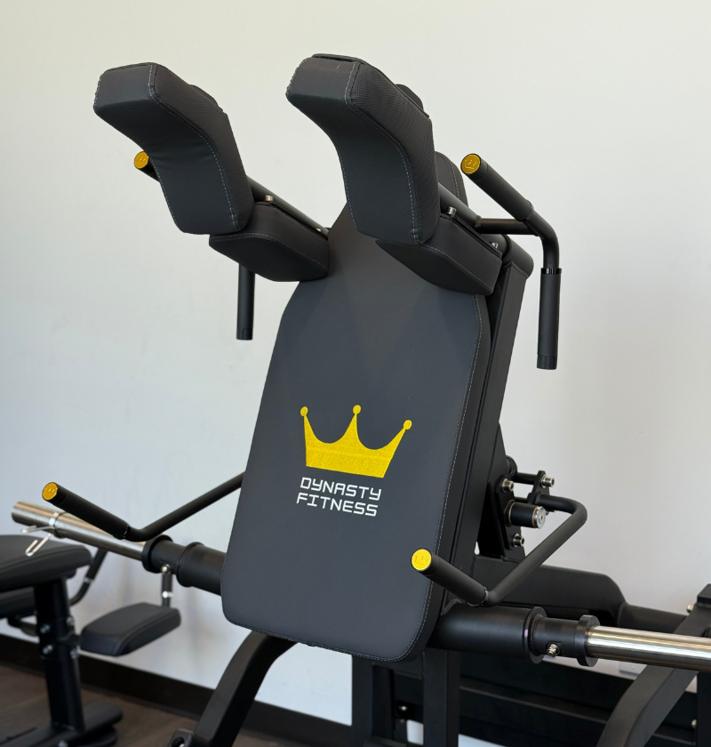 Up-close of the v squat machine pad on a showroom floor.