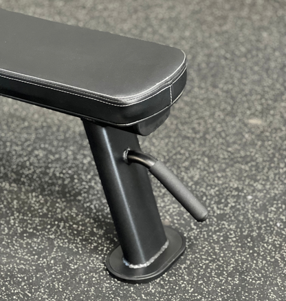 A black bench featuring a sleek black seat and a matching handle 