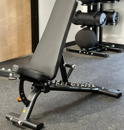 Adjustable Flat Incline Bench PL7328 displayed in a gym setting 