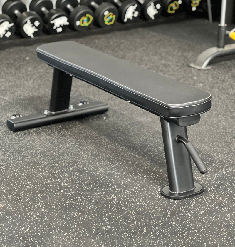 Black Flat Bench w/ Wheels in a gym setting 
