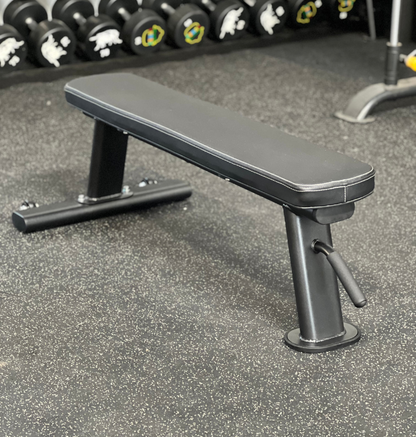 Black Flat Bench w/ Wheels in a gym setting 