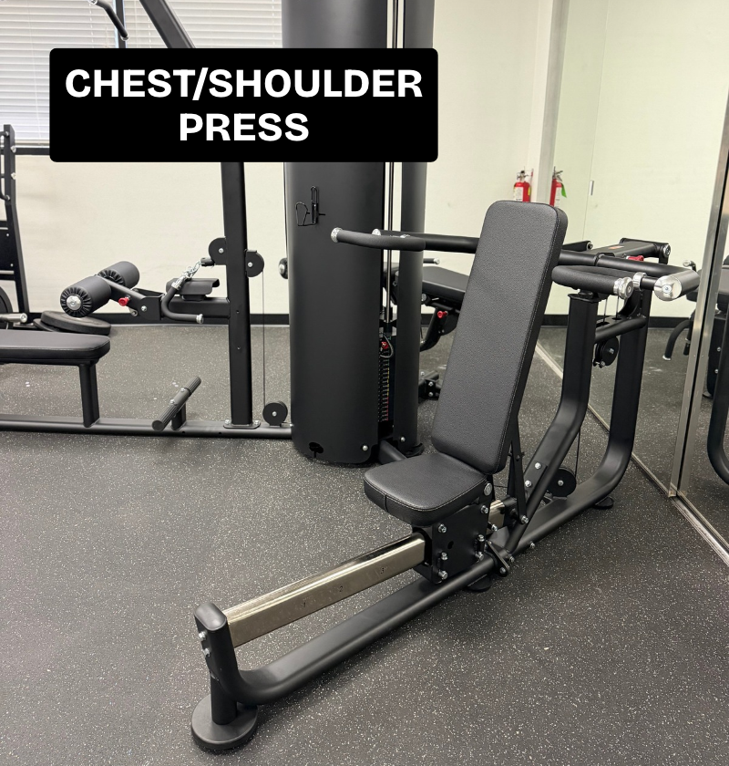 Black 3 stack multi station featuring the chest/shoulder press on speckled flooring.