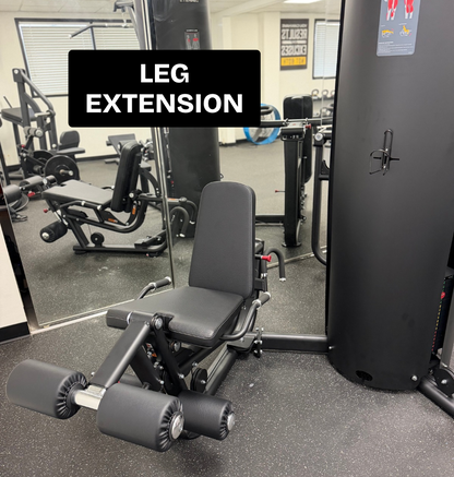 Black 3 stack multi station featuring the leg extension on speckled flooring.