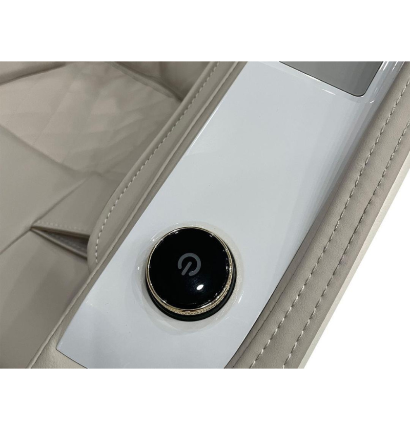 The center console of the car includes a button, which may activate the massage chair.