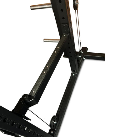 A black squat rack equipped with a barbell, designed as a power cage with a plate-loaded functional trainer.