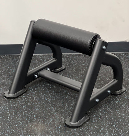 A black Bulgarian Split Squat Stand on the floor, intended for strength training exercises.