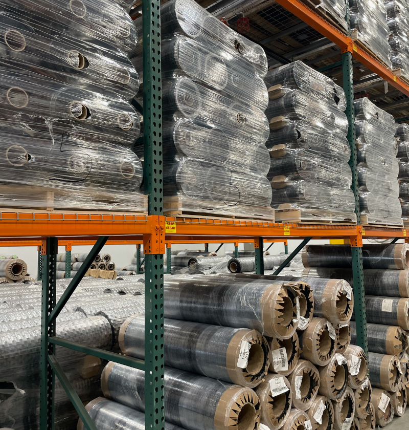pallets of rolled rubber gym flooring 