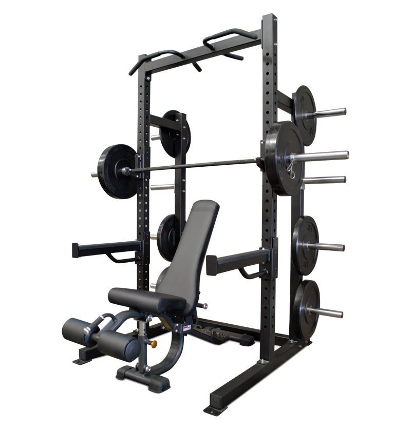 Black Pro Half Rack with a bench and weights, designed for strength training and fitness workouts.