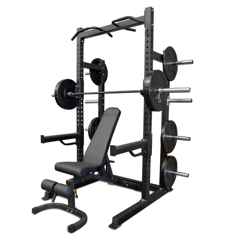 Black Pro Half Rack with a bench and weights, designed for strength training and fitness workouts.