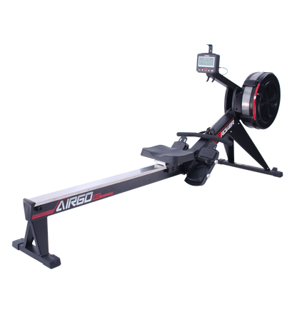 Commercial AirGo Rower rowing machine with black and red color scheme, featuring a thick padded seat, console with various function buttons, and air resistance mechanism.