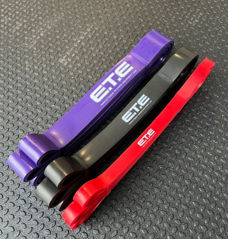 3 41" resistance bands varying in size in color with the label ETE in the middle of each band 