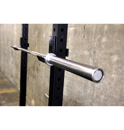 A Men's Olympic barbell securely mounted to a wall, ready for weightlifting exercises.