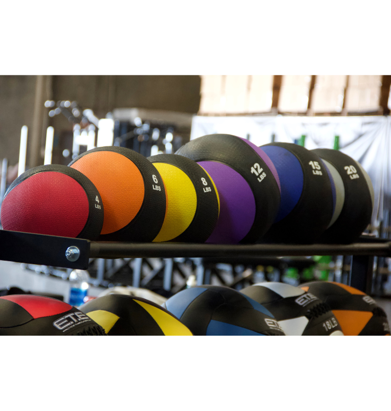 set of extreme training equipment rubber med balls varying in size and color 