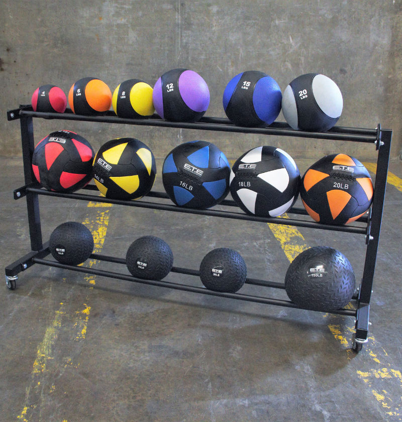 Set of ETE rubber med balls varying in size and weights, displayed on a 3-tier metal rack ideal for storage and saving space. 